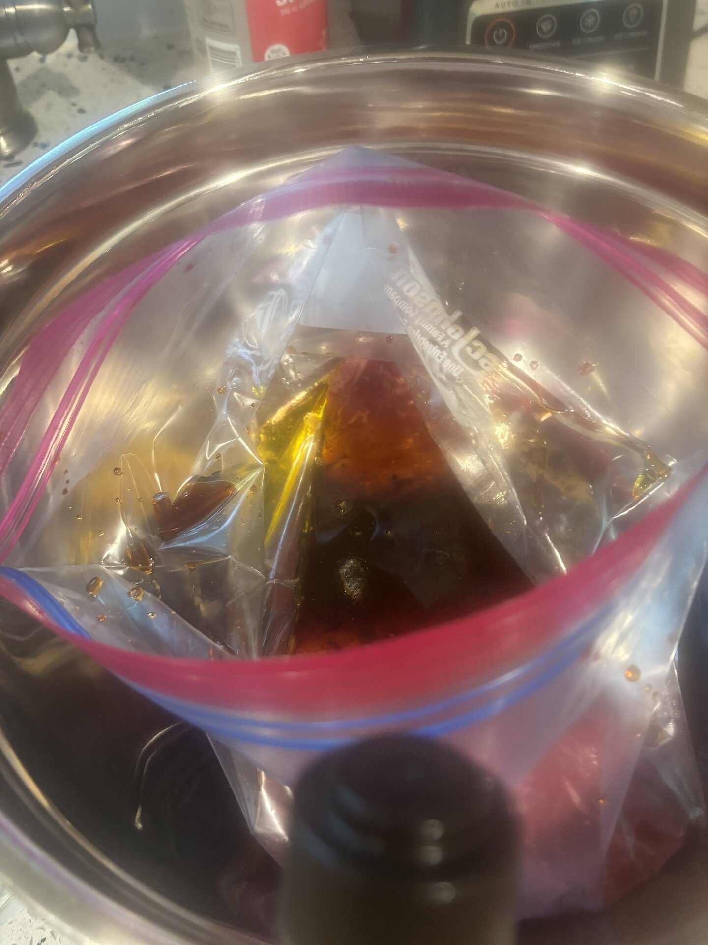marinade bag in stainless bowl on counter